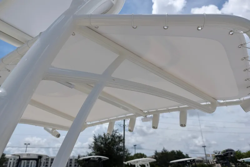 Slide: The Image of T-top canopy of 2027 Pathfinder 2700 Tournament boat under a cloudy sky. - 32