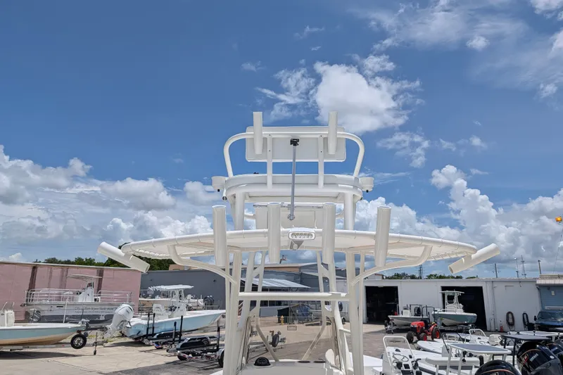 Slide: The Image of 2027 Pathfinder 2700 Tournament boat in a marina under a clear blue sky. - 10