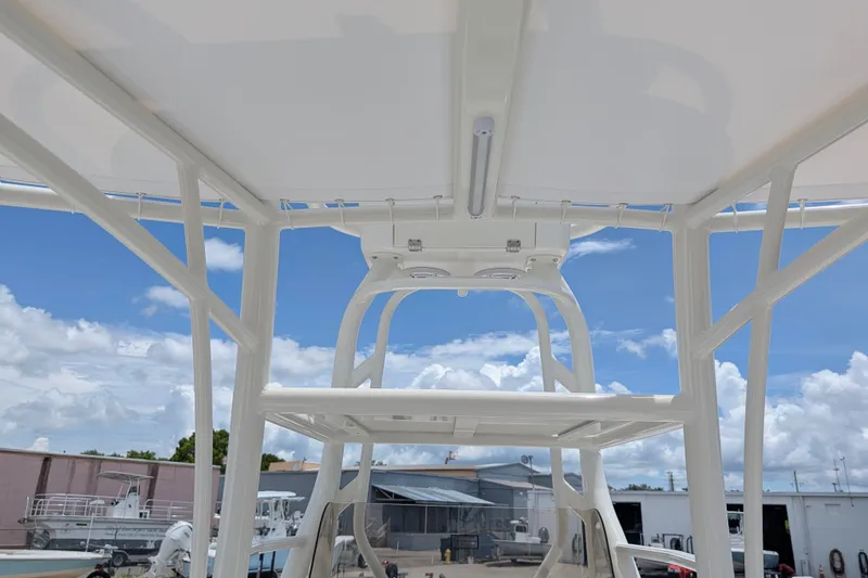 Slide: The Image of Pathfinder 2700 Tournament 2027 boat interior with T-top under blue sky. - 22
