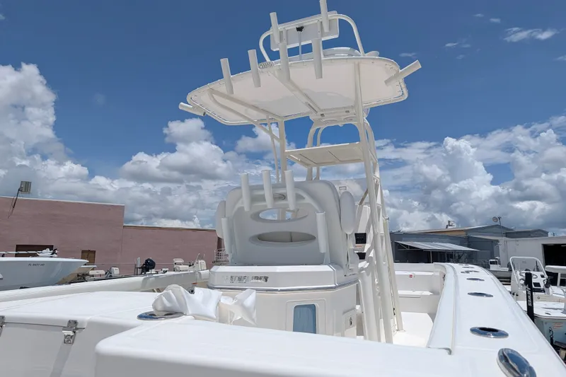 Slide: The Image of Pathfinder 2700 Tournament 2027 boat with tower, docked under a clear blue sky. - 4