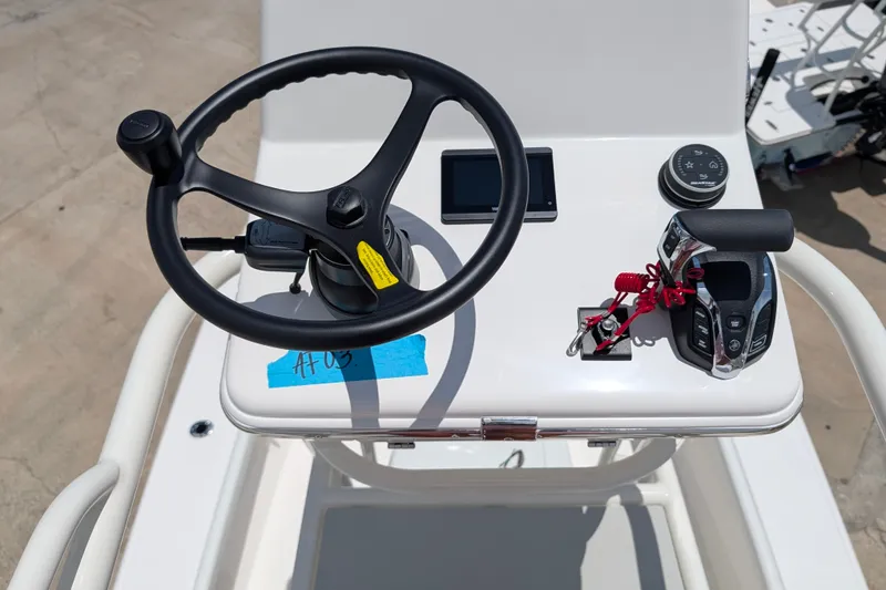 Slide: The Image of Steering console of 2027 Pathfinder 2700 Tournament boat with controls and display. - 49