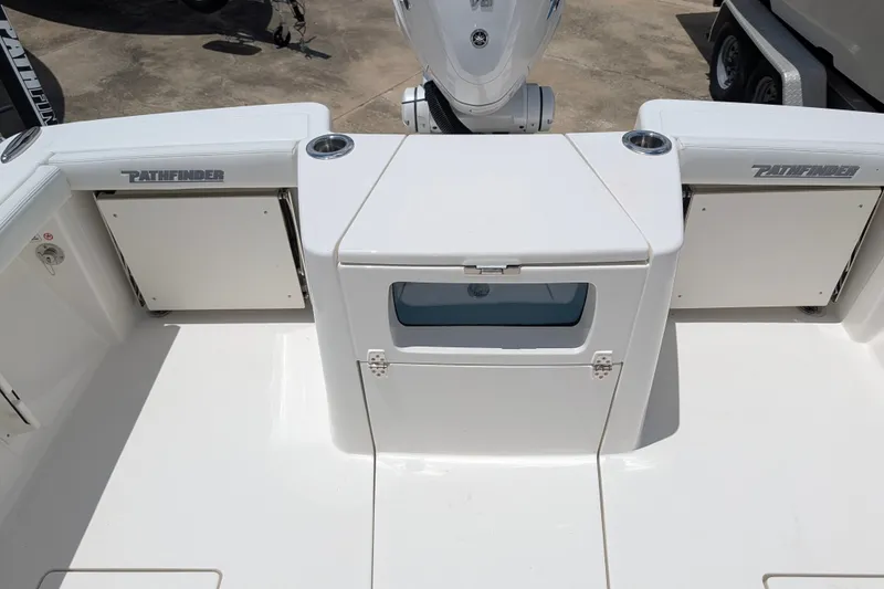 Slide: The Image of 2027 Pathfinder 2700 Tournament boat deck with storage compartments and motor. - 15