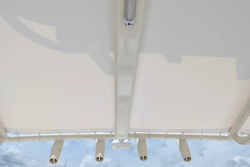 Slide: The Image of T-top view of 2027 Pathfinder 2700 Tournament boat against blue sky. - 58