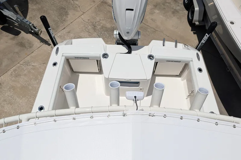 Slide: The Image of 2027 Pathfinder 2700 Tournament boat deck with rod holders and storage compartments. - 55