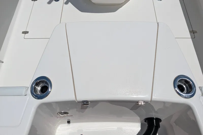 Slide: The Image of 2027 Pathfinder 2700 Tournament boat deck with rod holders and storage compartment. - 6