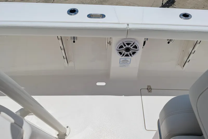 Slide: The Image of Interior view of a 2027 Pathfinder 2700 Tournament boat, featuring seating and speaker system. - 59