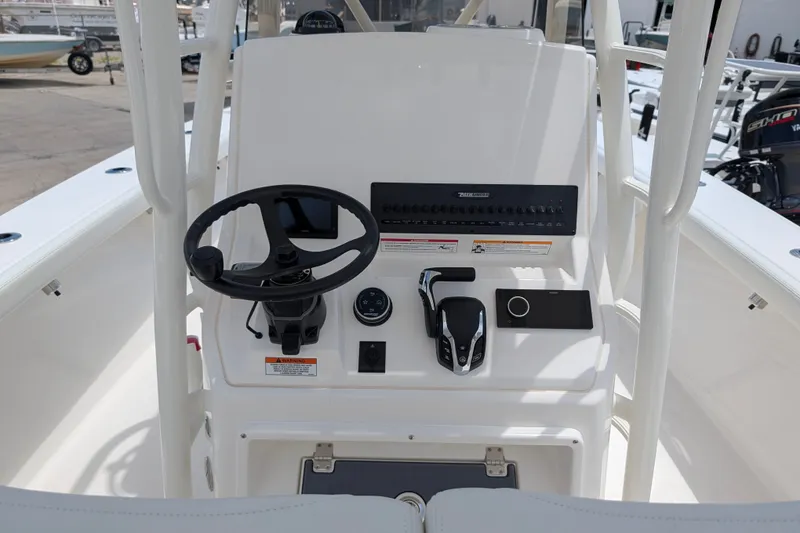 Slide: The Image of Steering console of 2027 Pathfinder 2700 Tournament boat with controls and gauges. - 21