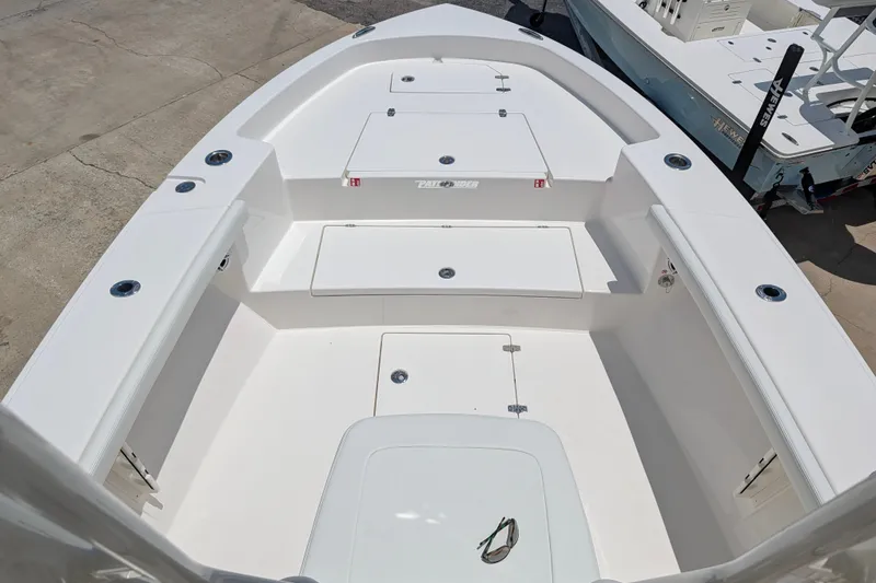 Slide: The Image of 2027 Pathfinder 2700 Tournament boat deck with storage compartments and sleek design. - 56