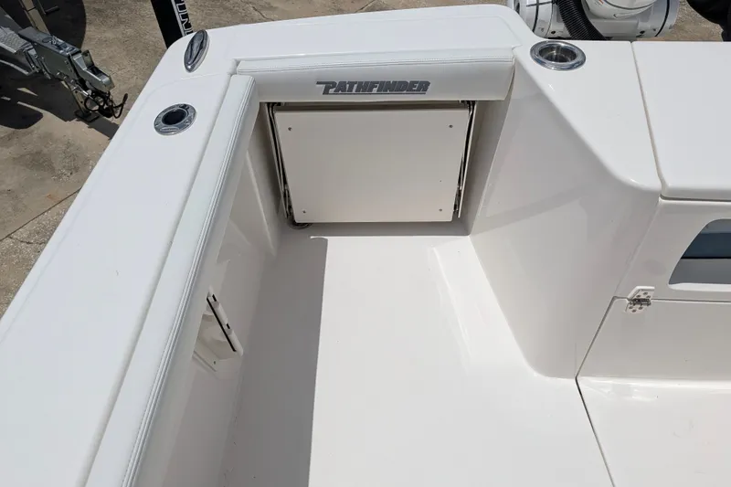 Slide: The Image of 2027 Pathfinder 2700 Tournament boat deck with storage compartment and sleek design. - 20