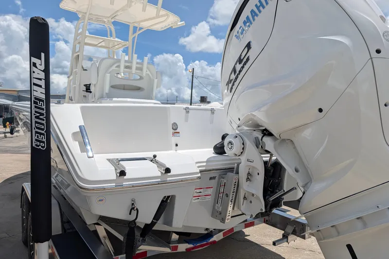 Slide: The Image of 2027 Pathfinder 2700 Tournament boat with Yamaha outboard motor, docked under a clear sky. - 3