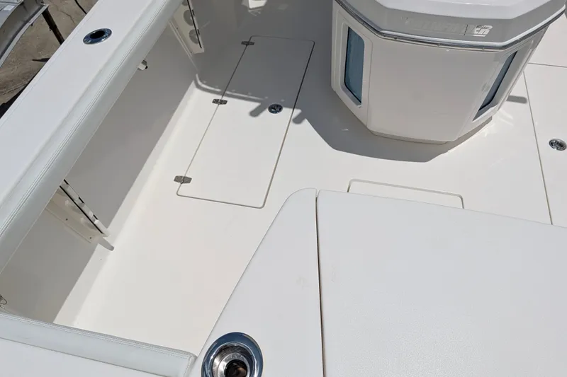 Slide: The Image of Interior view of a 2027 Pathfinder 2700 Tournament boat, showcasing sleek design and storage compartments. - 12