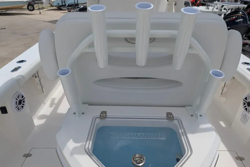 Slide: The Image of 2027 Pathfinder 2700 Tournament boat interior with rod holders and storage compartment. - 25