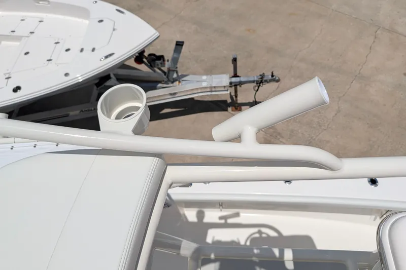 Slide: The Image of Pathfinder 2700 Tournament 2027 boat detail with rod holder and cup holder on deck. - 53