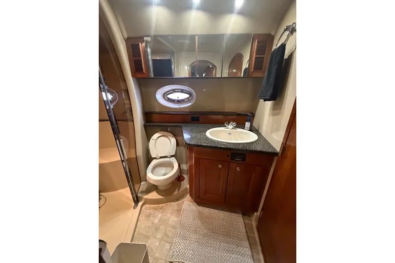 Slide: The Image of Luxurious bathroom in 2006 Cruisers Yachts 560 Express with modern fixtures and elegant design. - 15