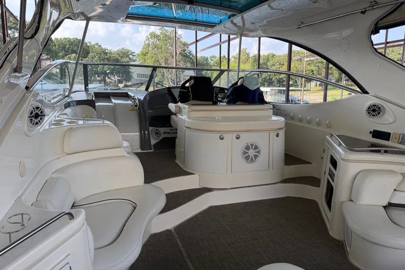 Slide: The Image of Luxurious interior of a 2006 Cruisers Yachts 560 Express, featuring elegant seating and helm. - 9