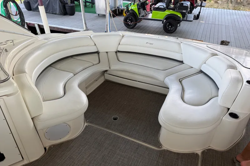 Slide: The Image of Luxurious white seating area on a 2006 Cruisers Yachts 560 Express boat. - 8
