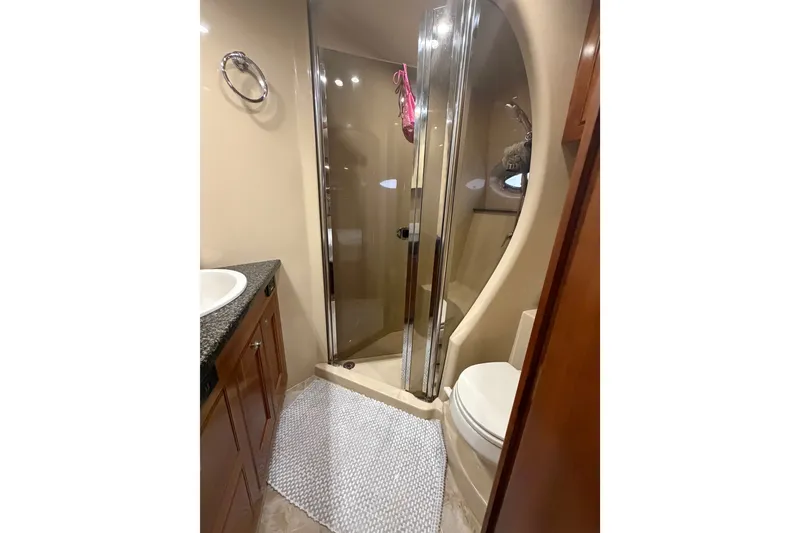 Slide: The Image of Luxurious bathroom in 2006 Cruisers Yachts 560 Express with shower and modern fixtures. - 18