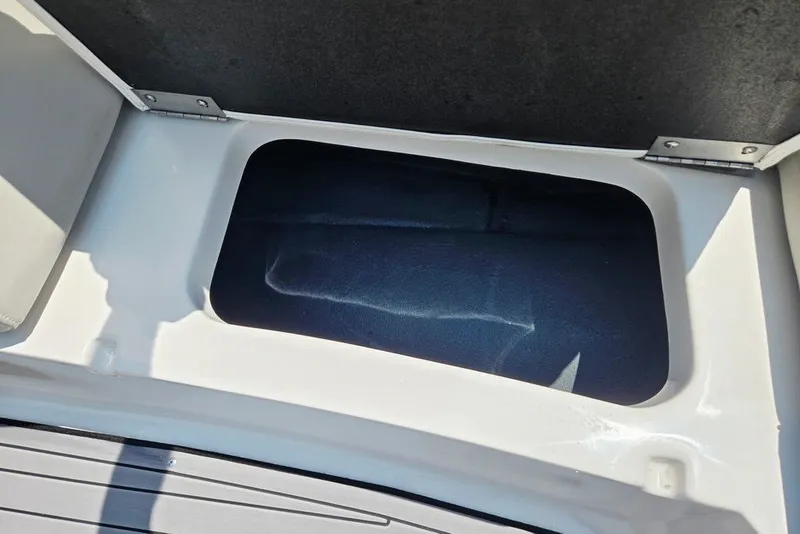 Slide: The Image of Storage compartment in 2024 Starcraft SVX 231 OB boat, featuring sleek design and ample space. - 11
