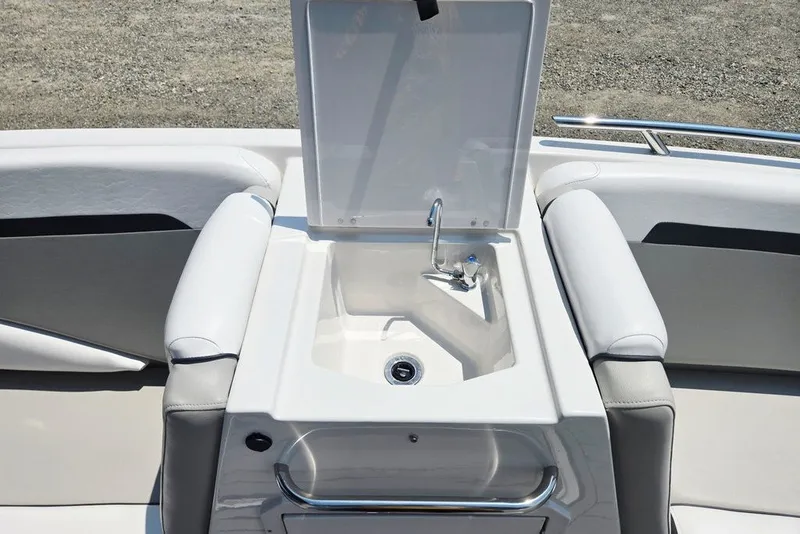 Slide: The Image of 2024 Starcraft SVX 231 OB boat interior with open sink and seating area. - 27
