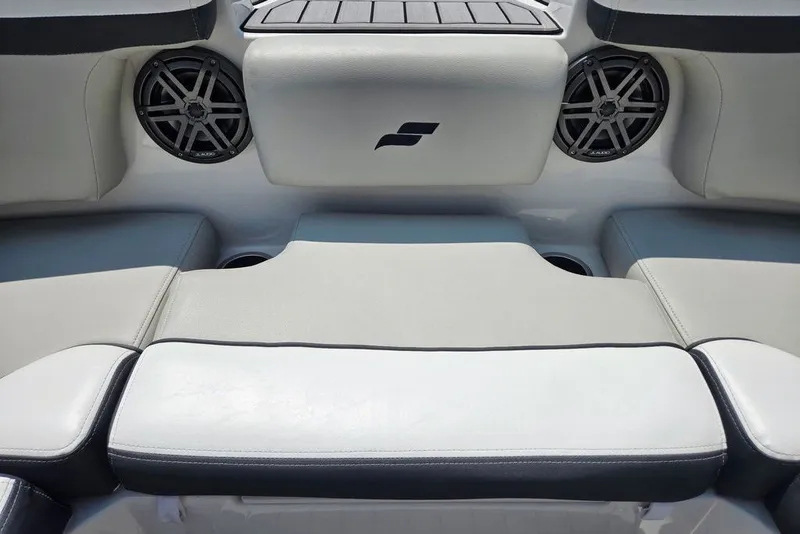Slide: The Image of 2024 Starcraft SVX 231 OB boat interior with cushioned seating and built-in speakers. - 19