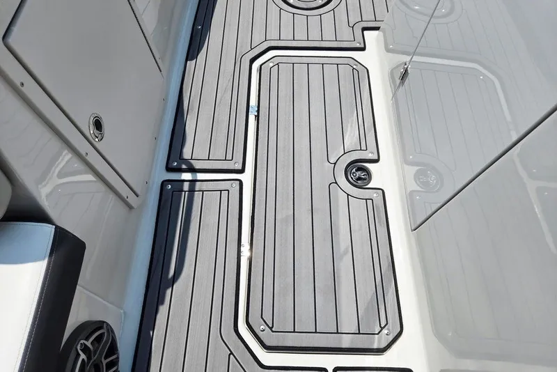 Slide: The Image of 2024 Starcraft SVX 231 OB boat deck with sleek, modern design and durable flooring. - 28