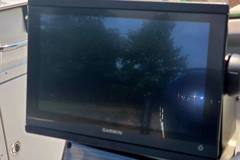 Slide: The Image of Garmin display on 2024 Starcraft SVX 231 OB boat, reflecting outdoor scenery. - 37
