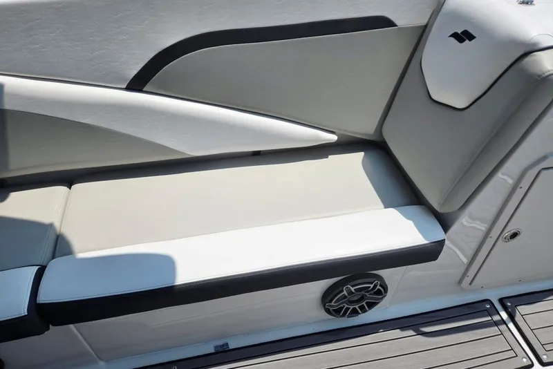Slide: The Image of 2024 Starcraft SVX 231 OB boat interior seating with sleek design and integrated speaker. - 41