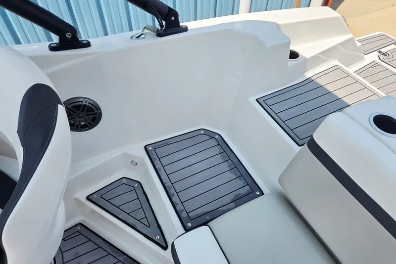Slide: The Image of 2024 Starcraft SVX 231 OB boat interior with sleek seating and modern flooring design. - 54