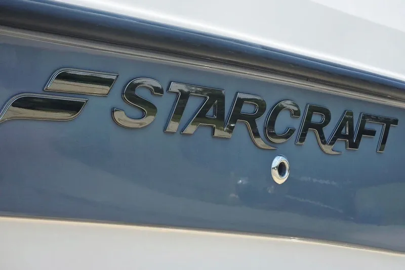 Slide: The Image of 2024 Starcraft SVX 231 OB boat logo on hull, close-up view. - 6