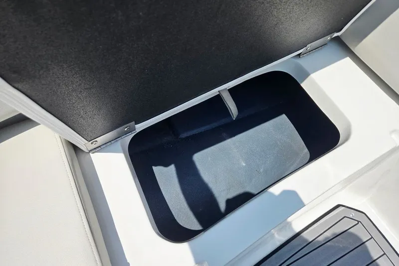 Slide: The Image of Storage compartment in 2024 Starcraft SVX 231 OB boat, featuring sleek design and ample space. - 32