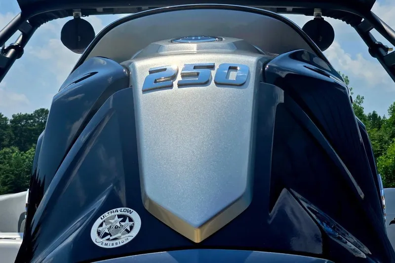 Slide: The Image of Close-up of 2024 Starcraft SVX 231 OB boat engine with "250" and ultra-low emission badge. - 8