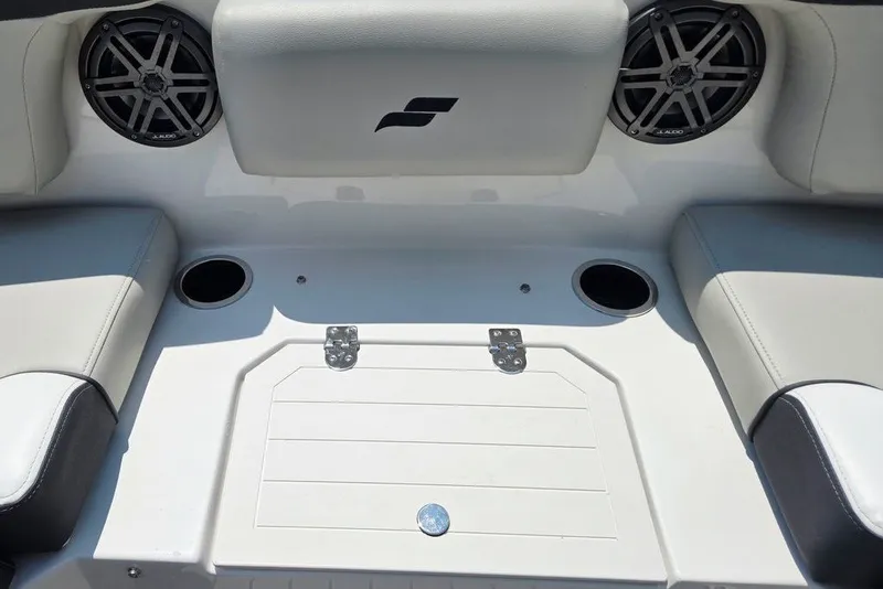 Slide: The Image of 2024 Starcraft SVX 231 OB boat interior with speakers and seating area. - 21