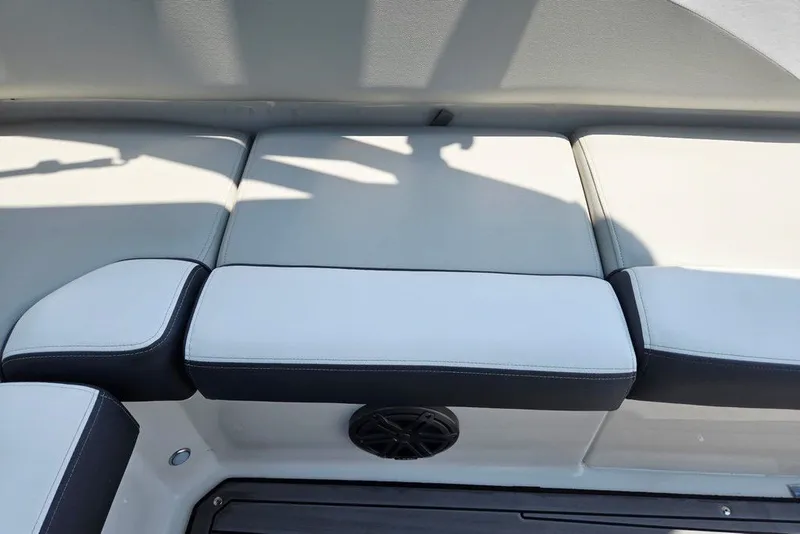 Slide: The Image of 2024 Starcraft SVX 231 OB boat interior seating with sleek, cushioned design. - 43