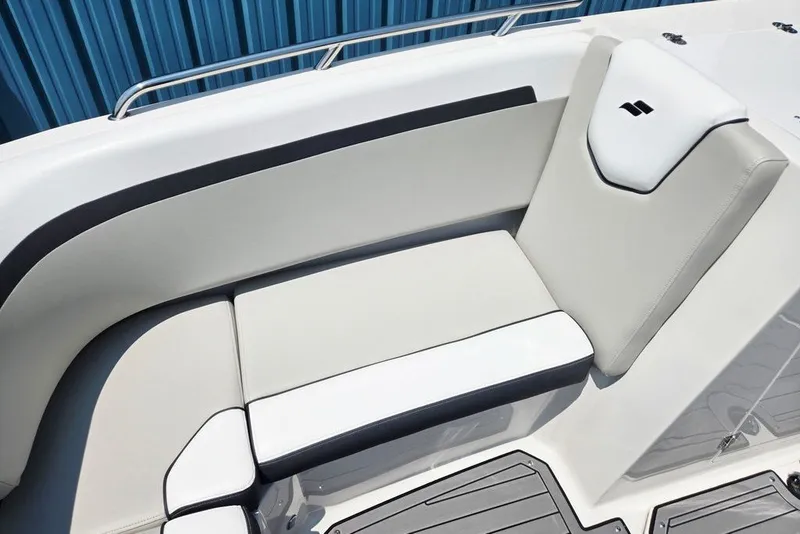 Slide: The Image of 2024 Starcraft SVX 231 OB boat interior seating with sleek white and black design. - 15