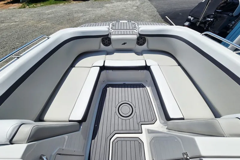 Slide: The Image of 2024 Starcraft SVX 231 OB boat interior with cushioned seating and sleek flooring. - 14