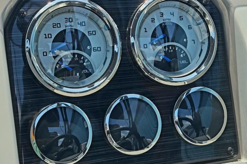 Slide: The Image of Dashboard gauges of 2024 Starcraft SVX 231 OB boat, displaying speed and fuel levels. - 38