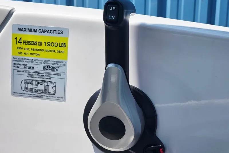 Slide: The Image of Throttle control and capacity label on 2024 Starcraft SVX 231 OB boat. - 34