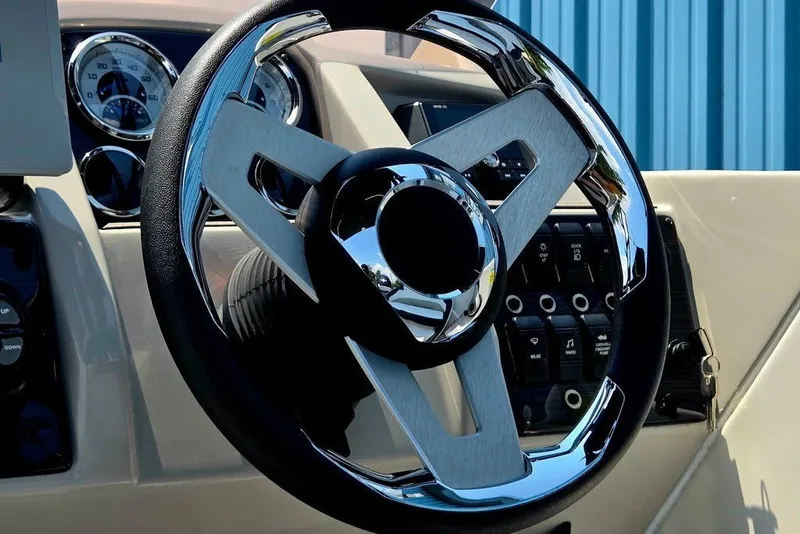 Slide: The Image of 2024 Starcraft SVX 231 OB steering wheel and dashboard close-up. - 35