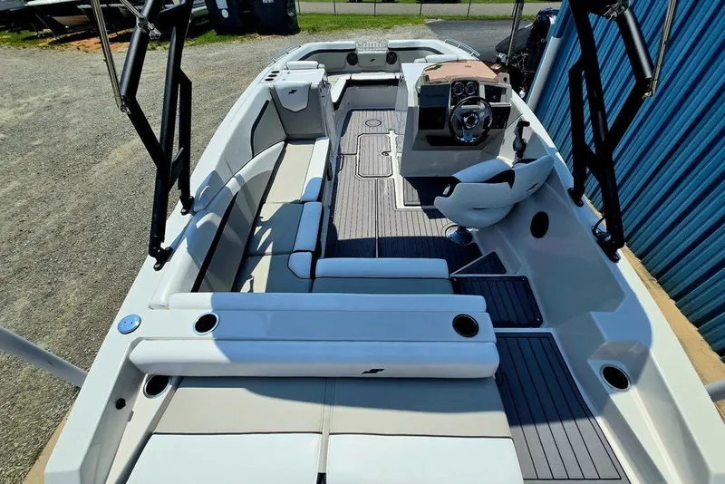 Slide: The Image of 2024 Starcraft SVX 231 OB boat interior with seating and steering console. - 51