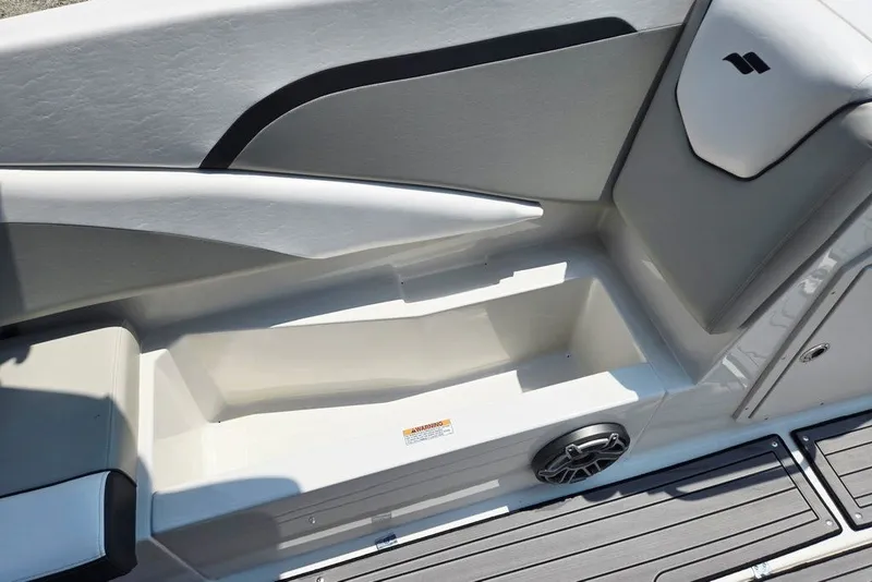 Slide: The Image of 2024 Starcraft SVX 231 OB boat interior with sleek seating and integrated speaker. - 44