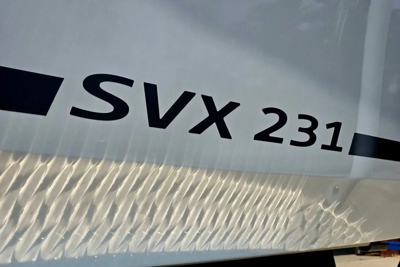 Slide: The Image of 2024 Starcraft SVX 231 OB boat model name on hull. - 7