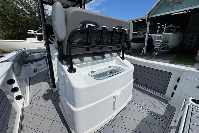 Slide: The Image of 2025 NauticStar 251 Hybrid boat interior with seating and storage features. - 38