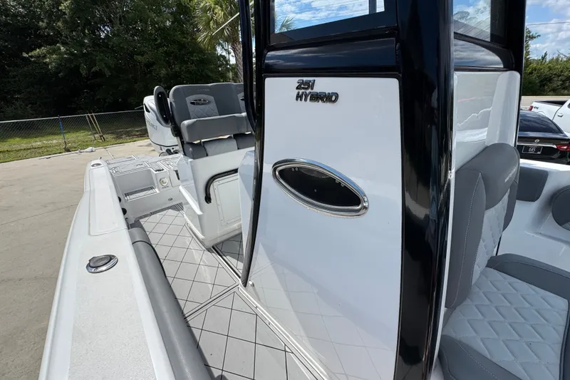 Slide: The Image of 2025 NauticStar 251 Hybrid boat interior with sleek seating and modern design. - 27