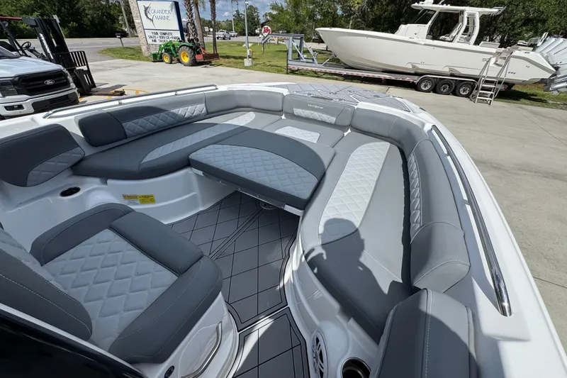 Slide: The Image of 2025 NauticStar 251 Hybrid boat interior with gray cushioned seating and modern design. - 18