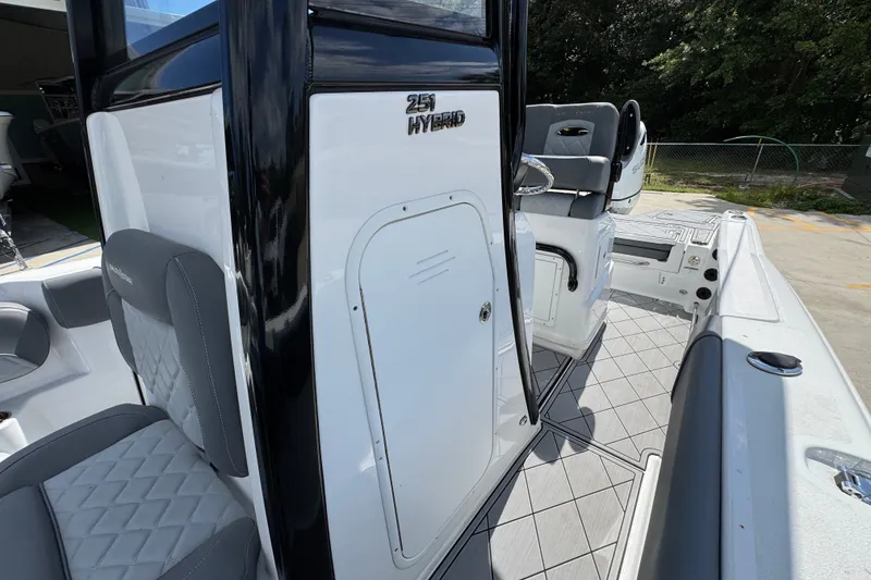 Slide: The Image of 2025 NauticStar 251 Hybrid boat interior with sleek seating and modern design. - 26