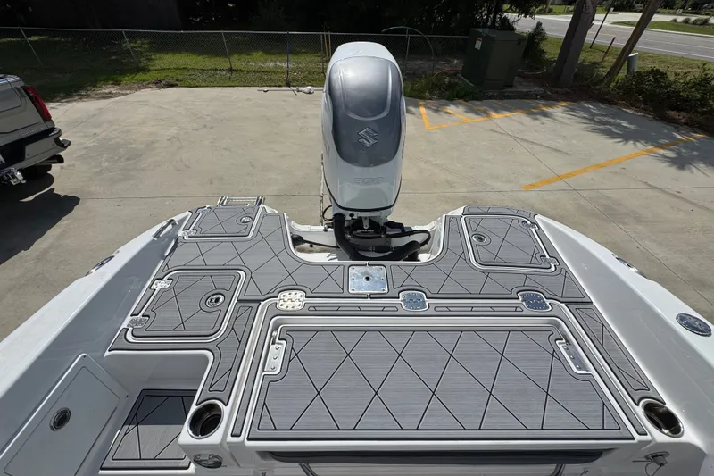 Slide: The Image of 2025 NauticStar 251 Hybrid boat with sleek deck design and powerful outboard motor. - 41