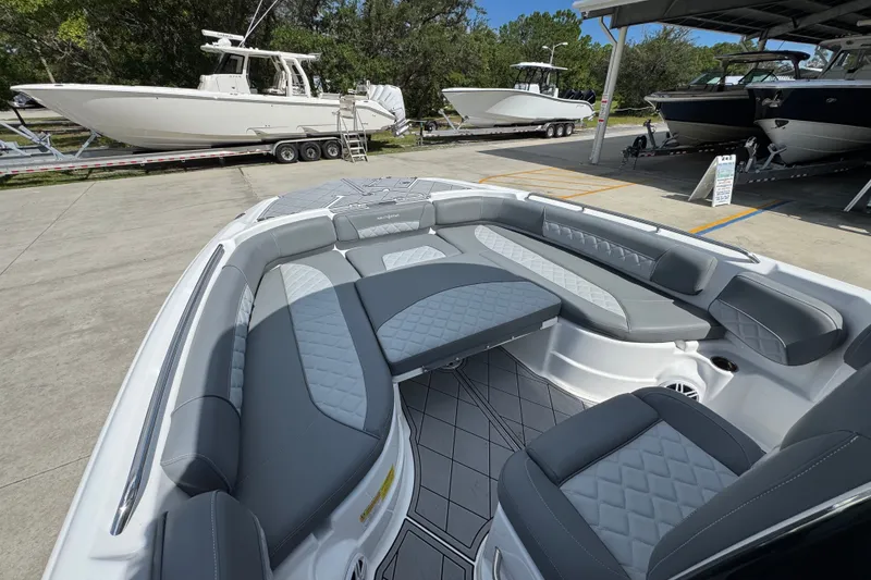 Slide: The Image of 2025 NauticStar 251 Hybrid boat interior with gray seating and diamond-patterned upholstery. - 20