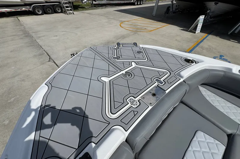 Slide: The Image of 2025 NauticStar 251 Hybrid boat deck with sleek gray seating and modern design. - 21