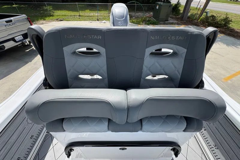 Slide: The Image of 2025 NauticStar 251 Hybrid boat seats with gray upholstery and diamond stitching. - 30