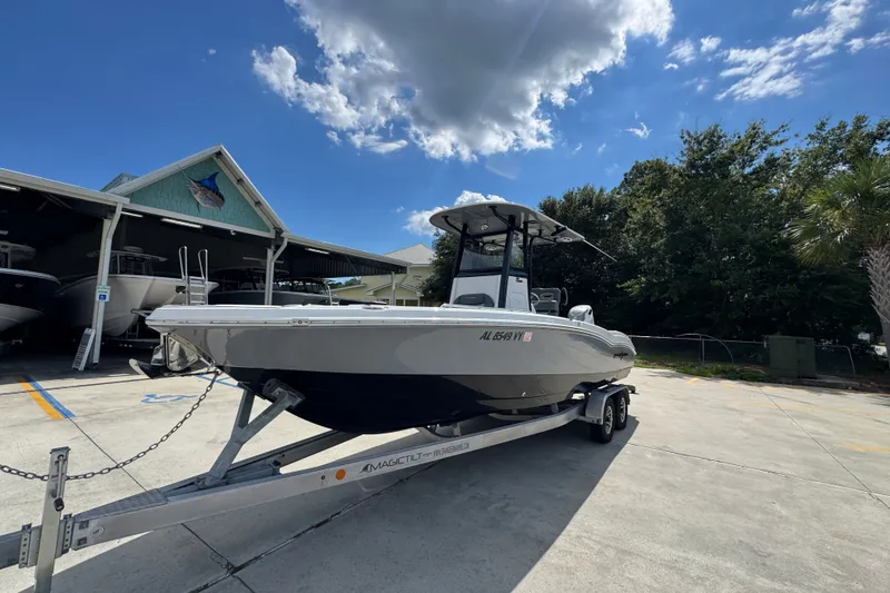 Slide: The Image of 2025 NauticStar 251 Hybrid boat on trailer under blue sky. - 4